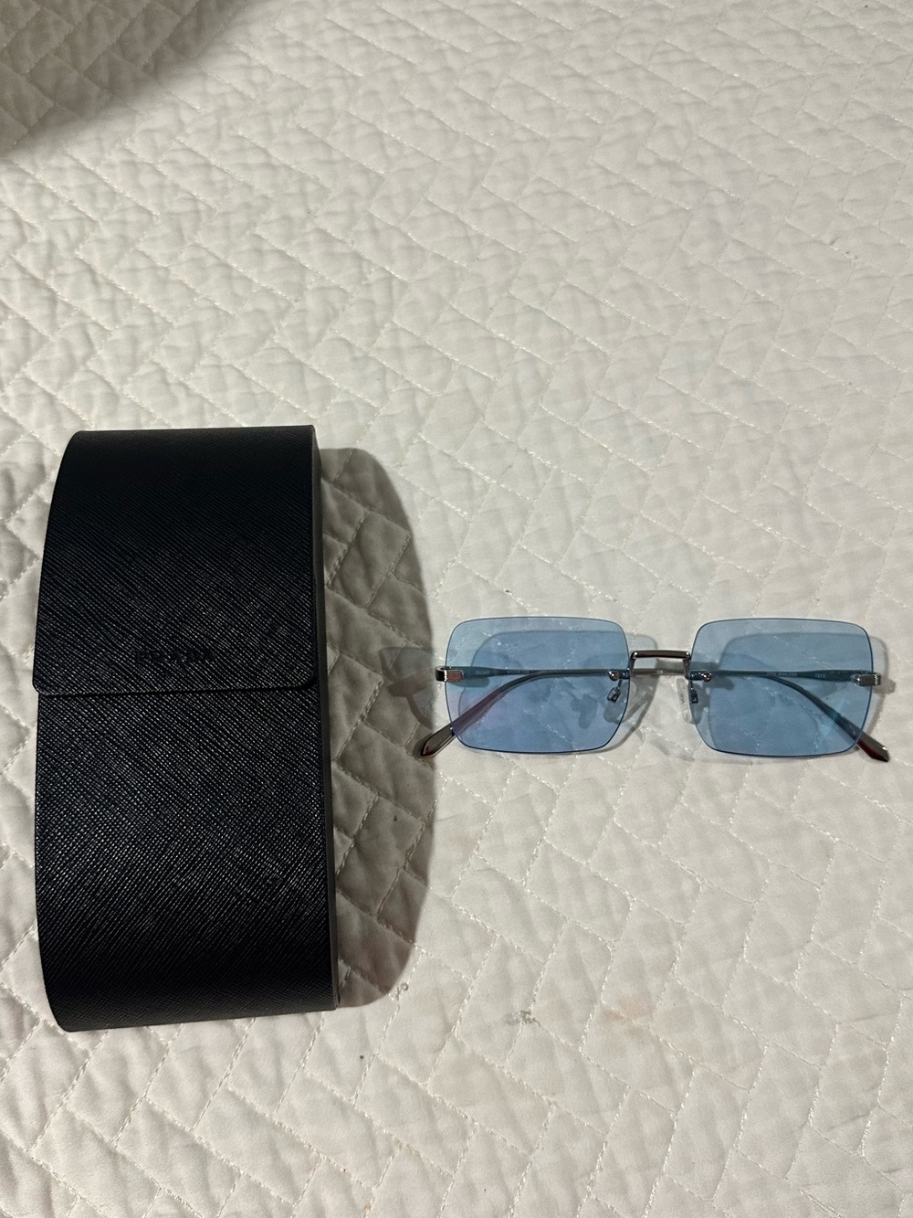 Prada- rimless sunglasses